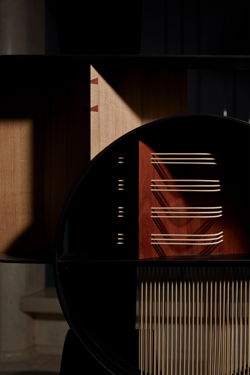 Close up of A modern abstract sculpture with various geometric shapes and wooden elements